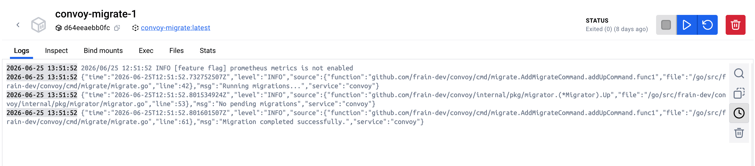 The migration container exits after successfully preparing the database